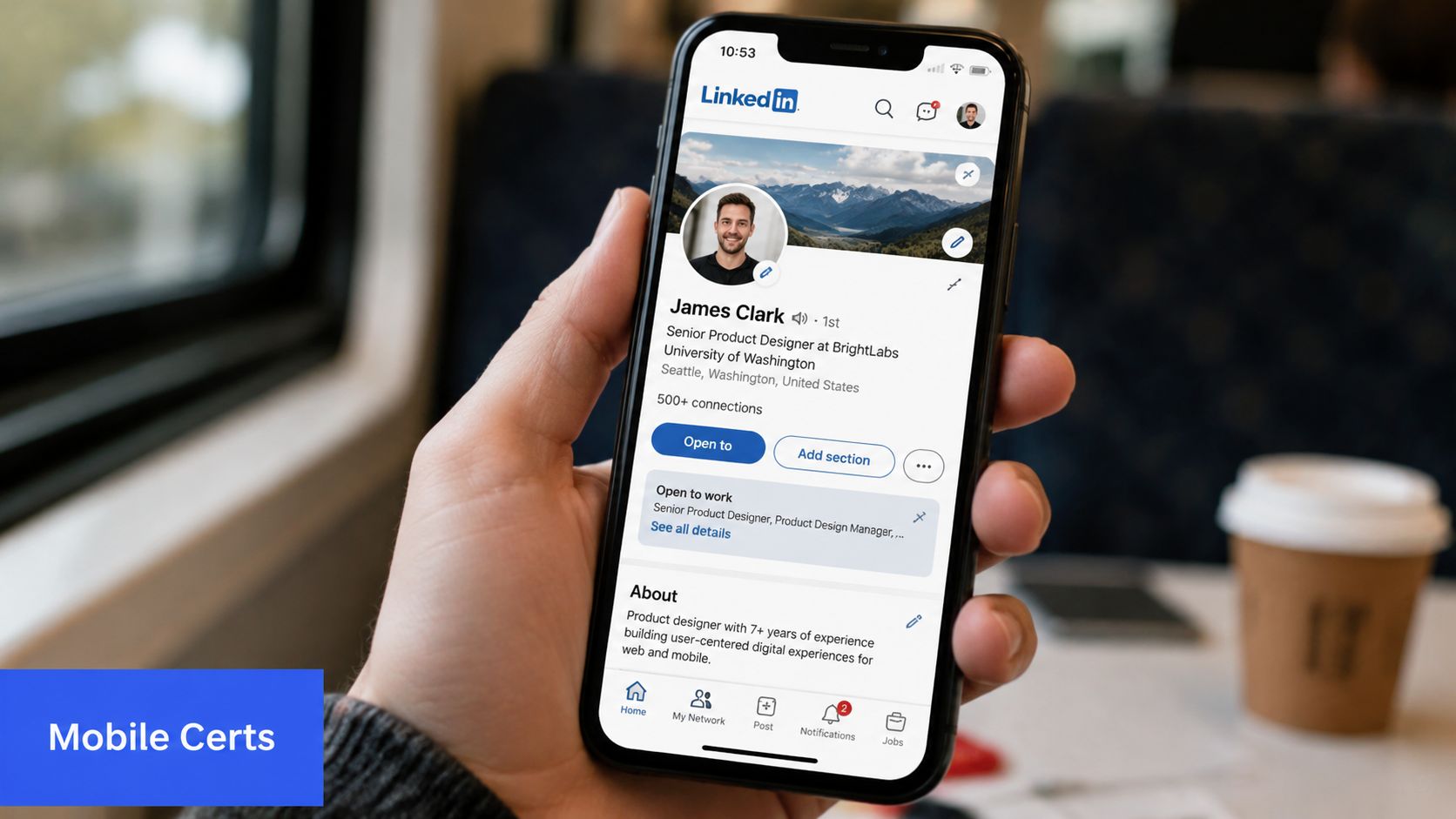 A close-up of a hand holding a smartphone displaying a professional LinkedIn user profile on screen.