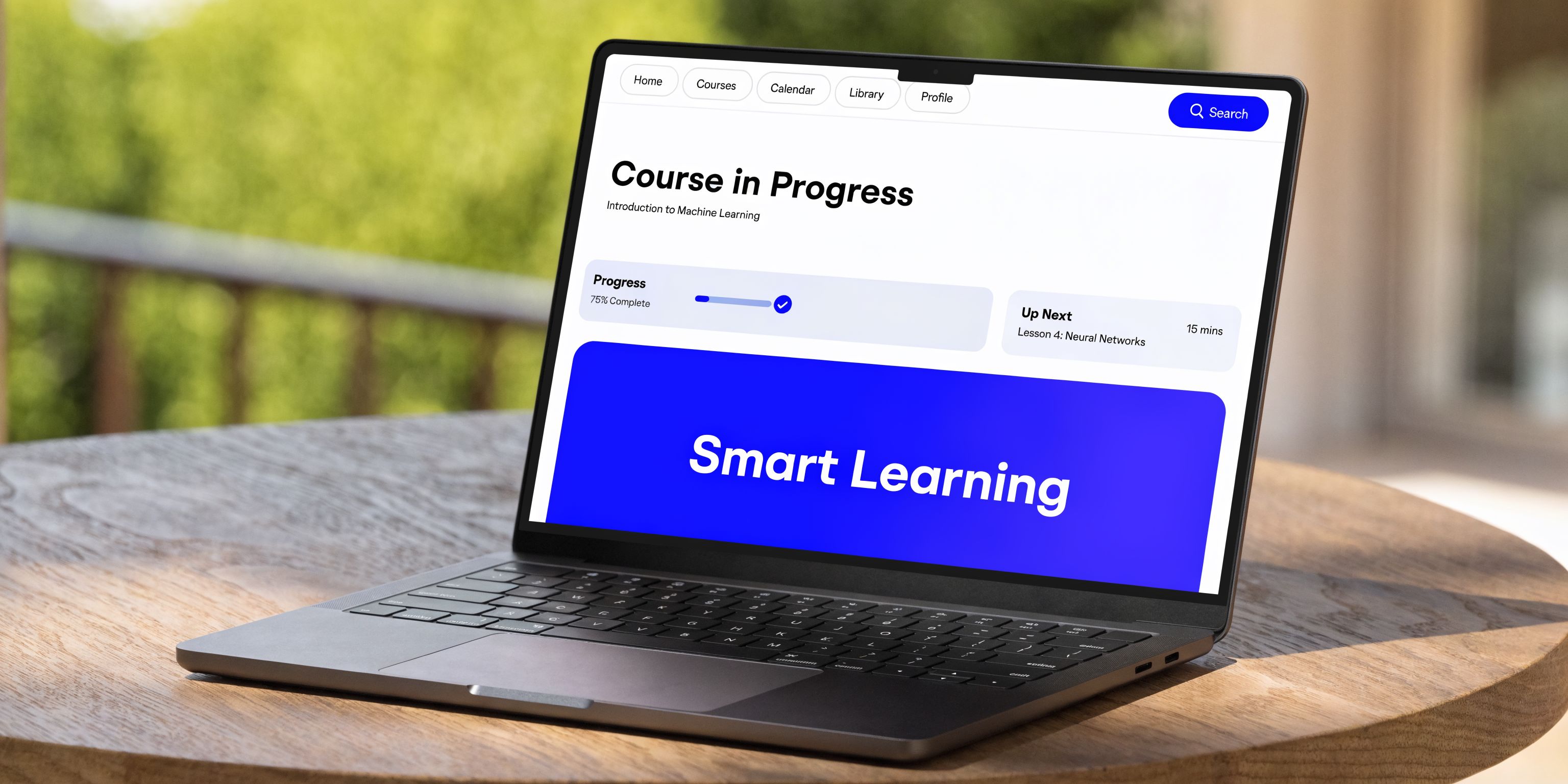 A sleek laptop on a wooden table displaying an online learning interface for machine learning courses.