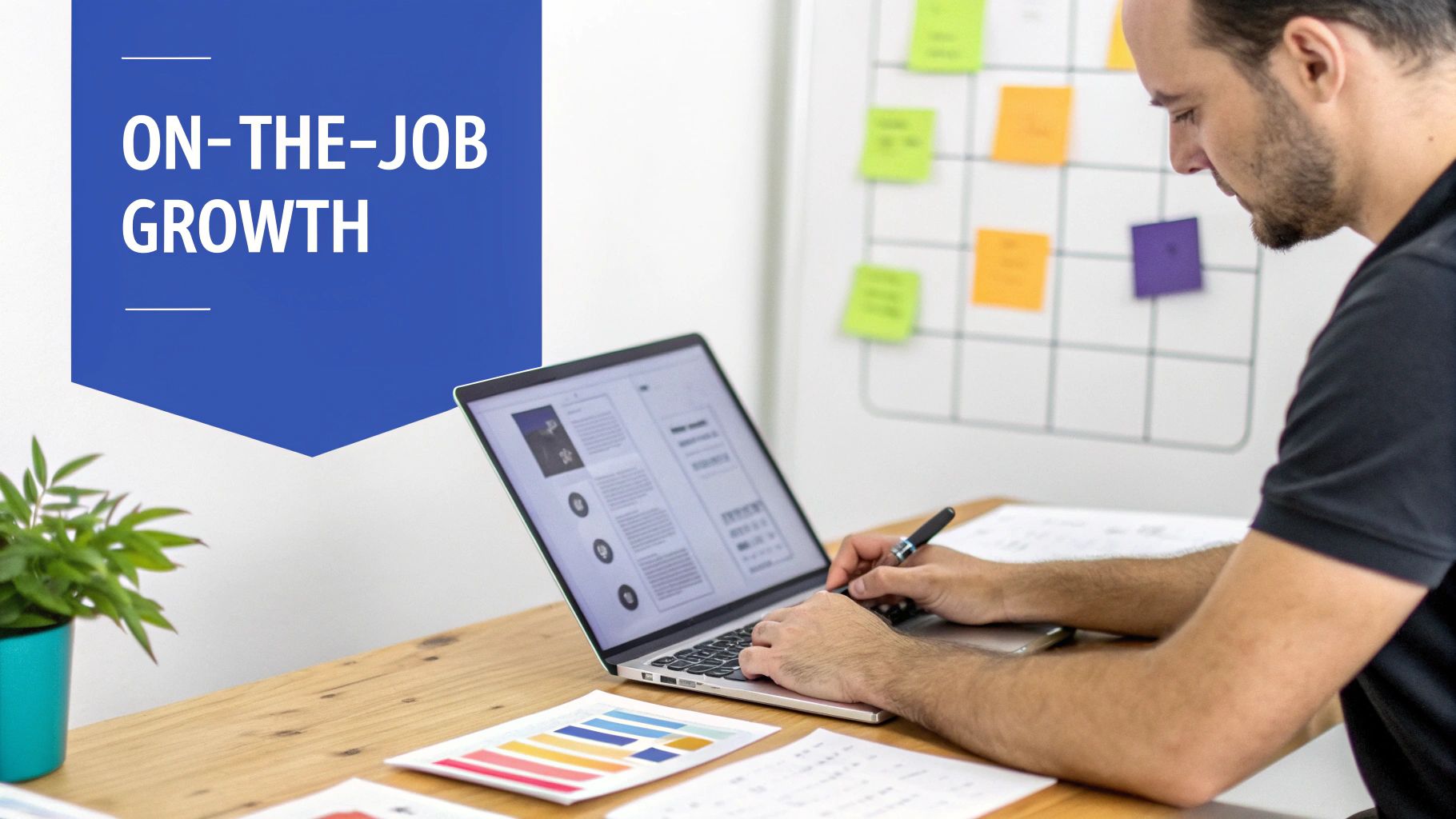 A man works on a laptop at a wooden desk, with a blue banner displaying 'ON-THE-JOB GROWTH'.
