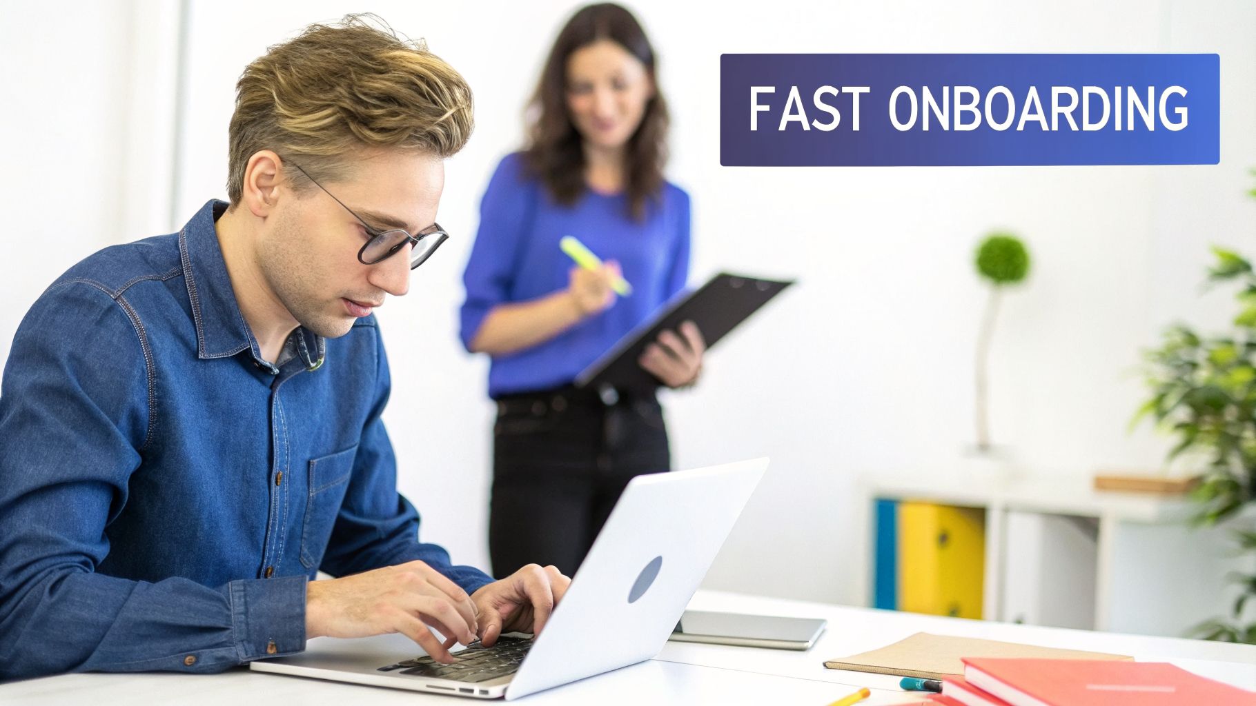 A man types on a laptop at a desk with a woman standing in the background, text 'FAST ONBOARDING'.